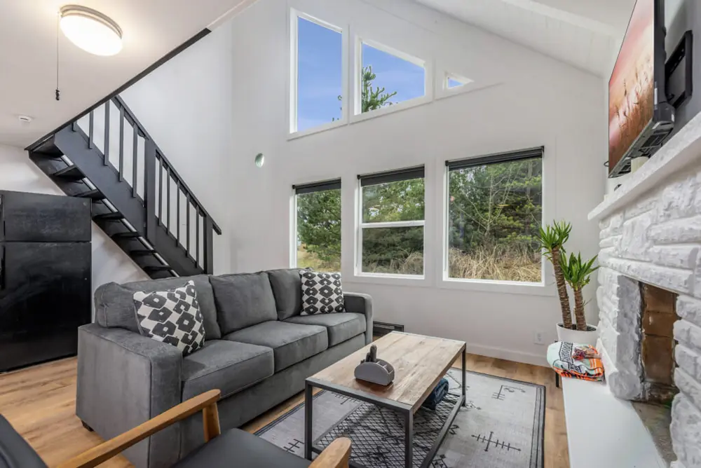 Bright living room inside a modern Tidal House chalet